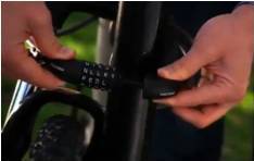 Combination Cable & Bike Locks: Lock being installed on bike