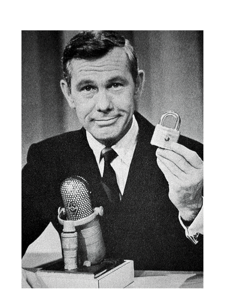 Johnny Carson holding a Master Lock 41w padlock.