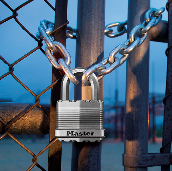 Master Lock magnum padlock on chained fence.