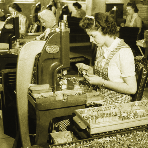 Master Lock worker assembling padlocks in factory during World War II.