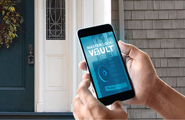The Master Lock Vault app open on a smartphone at a front door