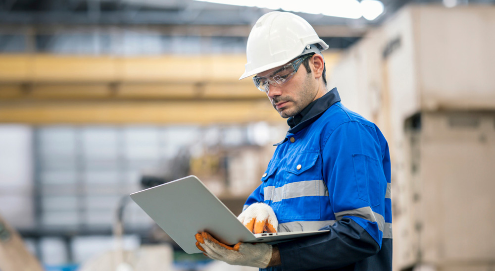 Service man carrying laptop